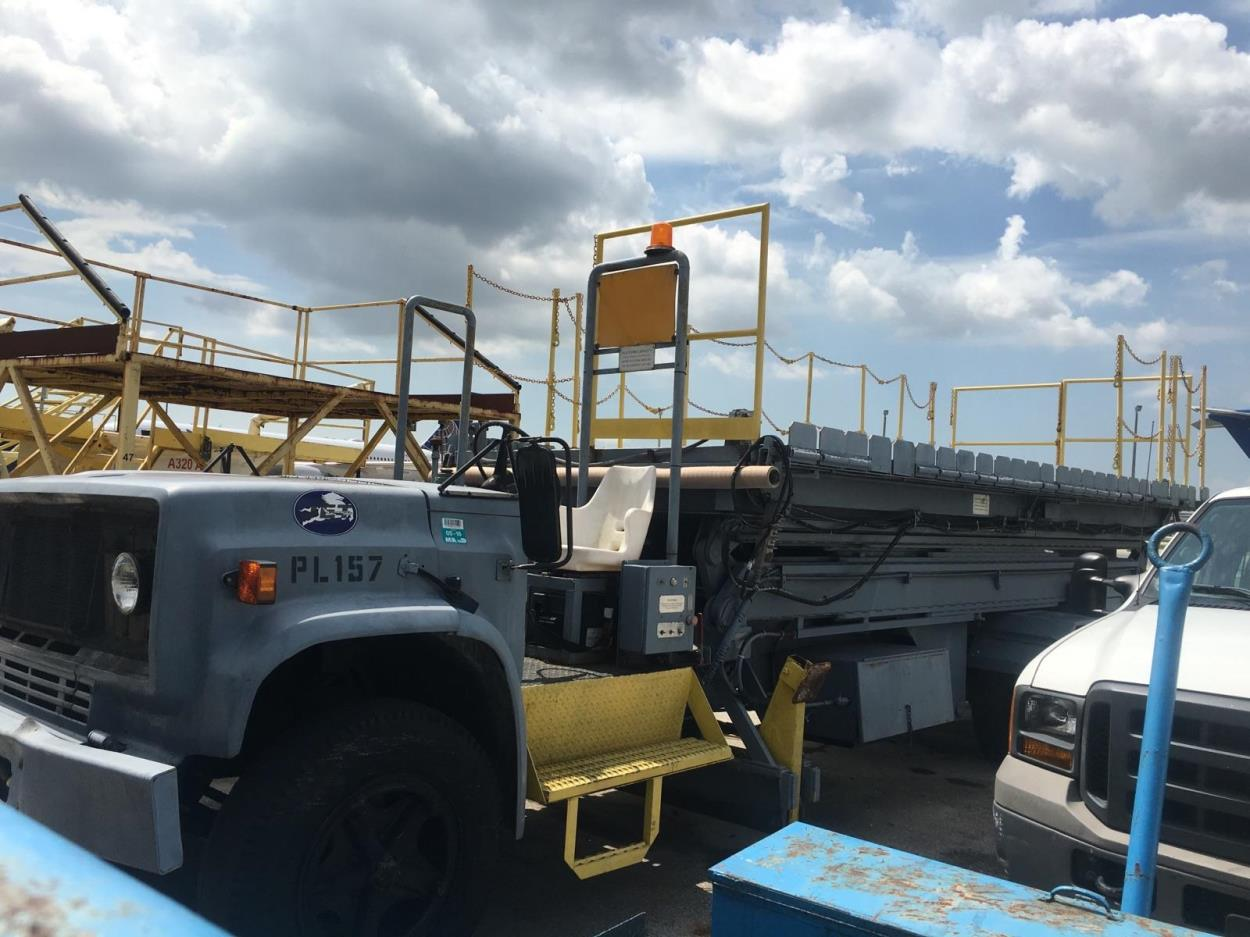 Ship a 1990 Nordco Scissor Lift with an F350 Open Cab to Fort