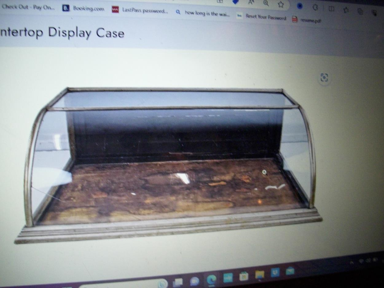 Deliver a wooden countertop display with glass front to