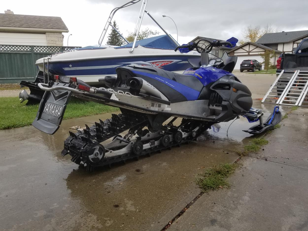 Transport a snowmobile Edmonton to Bthurst New Brunswick or c to