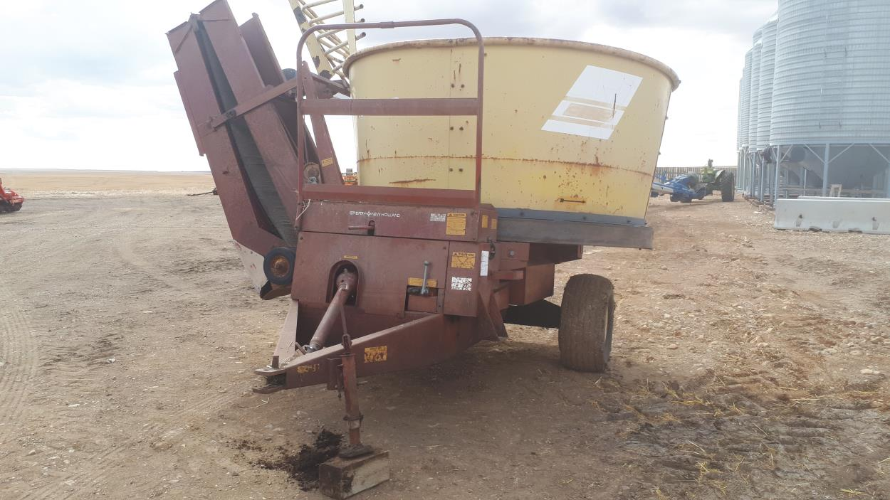 Ship a New Holland 393 tub grinder to Theodore uShip