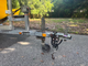 Small, lightweight sailboat on roadworthy trailer
