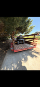 Open Trailer with Riding Lawn Mower on it