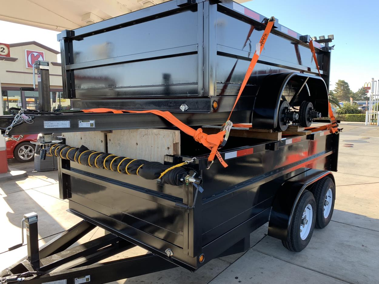 Cost to Transport a (2) 8x10x2 dump trailers stacked tow away to Loomis