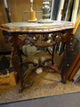 Carved lamp table with a removable marble top