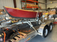 Drift boat on trailer & outboard motor